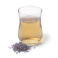 Glass cup with lavender tea and a fresh twig of lavender on white background Royalty Free Stock Photo