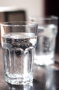 Glass cup with mineral water on the table