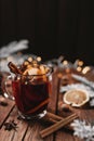 Glass cup of Mulled Wine on wooden table and background. Christmas time concept Royalty Free Stock Photo