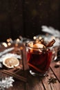 Glass cup of Mulled Wine on wooden table and background. Christmas time concept Royalty Free Stock Photo