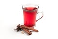 a glass cup of a red warming drink (tea, mulled wine, punch). ingredients for winter hot drinks Royalty Free Stock Photo