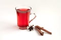 a glass cup of a red warming drink (tea, mulled wine, punch). ingredients for winter hot drinks Royalty Free Stock Photo