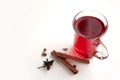 a glass cup of a red warming drink (tea, mulled wine, punch). ingredients for winter hot drinks Royalty Free Stock Photo