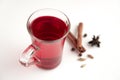 a glass cup of a red warming drink (tea, mulled wine, punch). ingredients for winter hot drinks Royalty Free Stock Photo