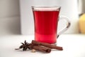 a glass cup of a red warming drink (tea, mulled wine, punch). ingredients for winter hot drinks Royalty Free Stock Photo