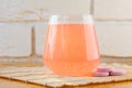 Glass cup on table with effervescent vitamins