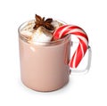 Glass cup of tasty cocoa with marshmallows, Christmas candy cane and anise isolated on white Royalty Free Stock Photo
