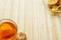 Glass cup of tea with biscuits and lemon on a light wooden background.Cup of tea with lemon and biscuits Royalty Free Stock Photo