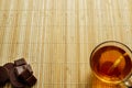 Glass cup of tea with biscuits and lemon on a light wooden background.Cup of tea with lemon and biscuits Royalty Free Stock Photo