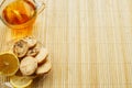 Glass cup of tea with biscuits and lemon on a light wooden background.Cup of tea with lemon and biscuits Royalty Free Stock Photo