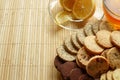 Glass cup of tea with biscuits and lemon on a light wooden background.Cup of tea with lemon and biscuits Royalty Free Stock Photo