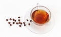 Glass cup of tea with coffee beans . White background. Isolated. Breakfast concept Royalty Free Stock Photo