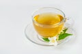 Glass cup of tea with jasmine on the white background Royalty Free Stock Photo