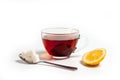 Glass cup for tea with a spoon, tea bag and lemon on a white background Royalty Free Stock Photo