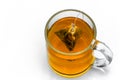 Glass cup with teabag, black tea. Isolated on a white Royalty Free Stock Photo