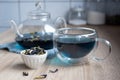 Glass cup and teapot with anchan from butterfly pea flower