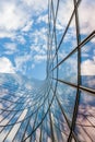 Glass curved building and blue sky