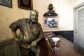 Glass of Daiquiri cocktail and statue of American writer Ernest Hemingway in the bar El Floridita in Havanna