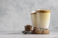 Glass with Dalgona frothy coffee. Trend korean drink with coffee foam. Royalty Free Stock Photo