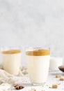 Glass with Dalgona frothy coffee. Trend korean drink with coffee foam. Royalty Free Stock Photo