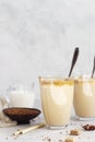 Glass with Dalgona frothy coffee. Trend korean drink with coffee foam. Royalty Free Stock Photo