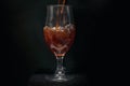 glass with dark beer, black background, pouring beer into glass, beer glass in pub Royalty Free Stock Photo