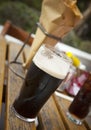Glass of dark beer fish and chips. Royalty Free Stock Photo