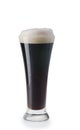 Glass of dark beer with froth Royalty Free Stock Photo