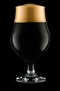 Glass of dark beer isolated on black background Royalty Free Stock Photo