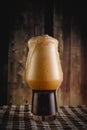 A glass of dark beer on wooden background. Stout in bar. Royalty Free Stock Photo