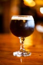 Glass of dark Belgian beer. Royalty Free Stock Photo