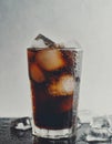 Glass of dark fizzy drink with ice cubes, cola or soda beverage on light background, summer refreshment cocktail Royalty Free Stock Photo