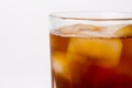 Glass with dark liquid full with ice cubes Royalty Free Stock Photo