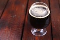 Glass of dark stout