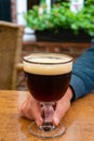 Glass of dark tasty Belgian dubbel brown beer from abbey brewery Royalty Free Stock Photo