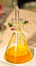 Glass decanter of olive oil with a beaker top Royalty Free Stock Photo