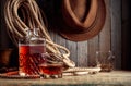 Glass and decanter with strong alcohol on a old wooden table Royalty Free Stock Photo