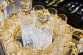 Glass decanters and glasses for drinks with golden decor