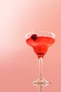 Glass of delicious alcohol drink, strawberry margarita cocktail isolated over pink background Royalty Free Stock Photo