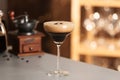 Glass of delicious Espresso Martini on bar counter