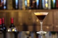Glass of delicious Espresso Martini on bar counter. Alcohol cocktail Royalty Free Stock Photo