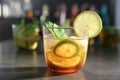 Glass with delicious mint julep on bar counter