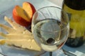 Glass of desert white wine with cheese and fruit, closeup Royalty Free Stock Photo