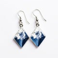 Glass Diamond Earrings With Blue Snowflake: A Stunning Combination Of Dark White, Light Indigo, And High-key Lighting Royalty Free Stock Photo