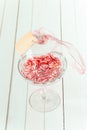 Glass dish with striped sweets and gift tag
