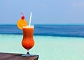 Glass of drink is on a beach table Royalty Free Stock Photo