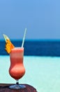Glass of drink is on a beach table Royalty Free Stock Photo
