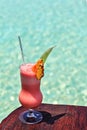 Glass of drink is on a beach table Royalty Free Stock Photo