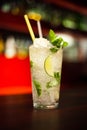 Glass with drinks and alcohol and citrus in bar table 