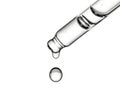 Glass dropper with liquid drops, isolated on white background Royalty Free Stock Photo